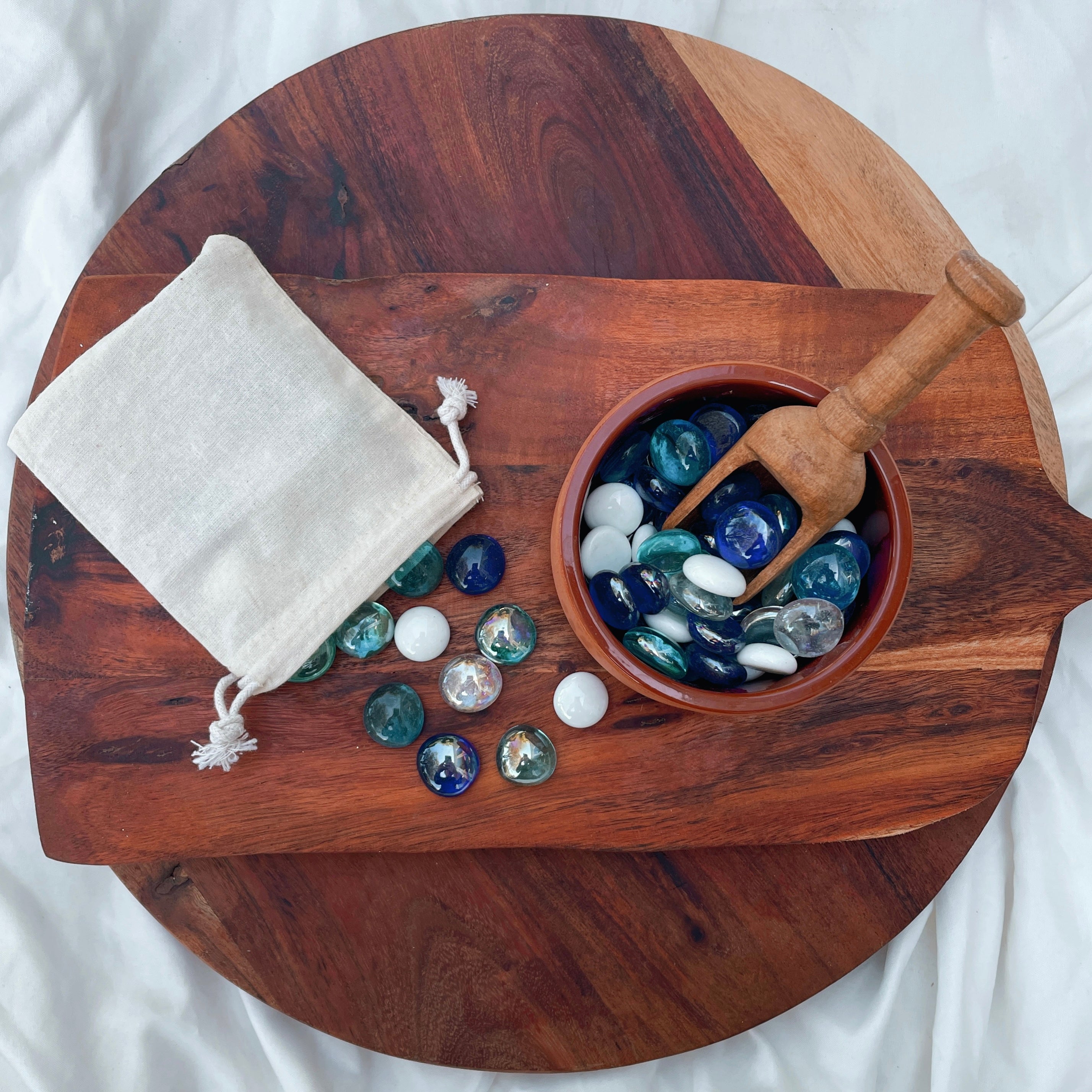 Small tumbled stones and crystal chips. Perfect addition to your NZ made play dough, sure to inspire a little sparkle in your child's sensory play. Part of our loose parts collection. perfect for ocean play