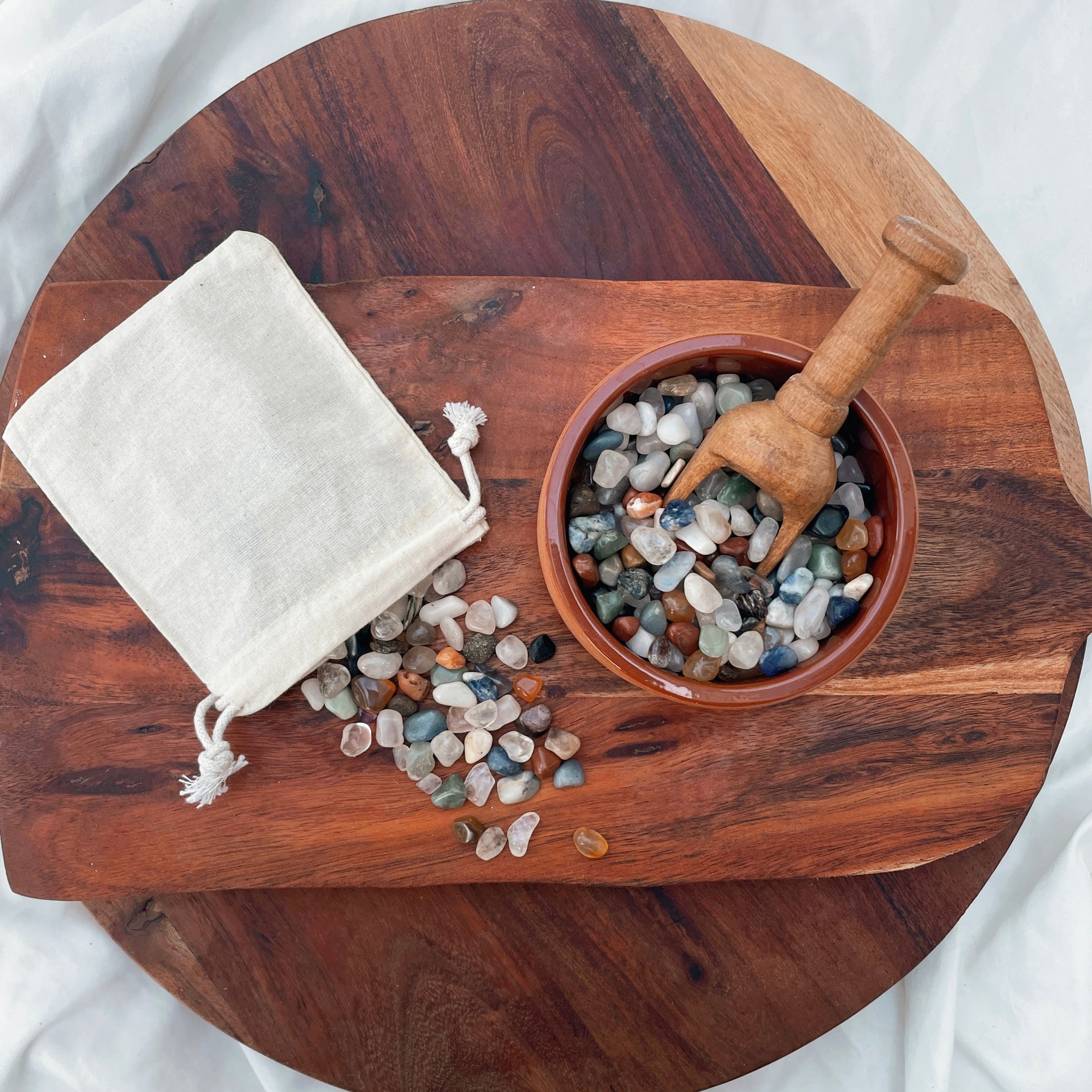 Small tumbled stones and crystal chips. Perfect addition to your NZ made play dough, sure to inspire a little sparkle in your child's sensory play. Part of our loose parts collection