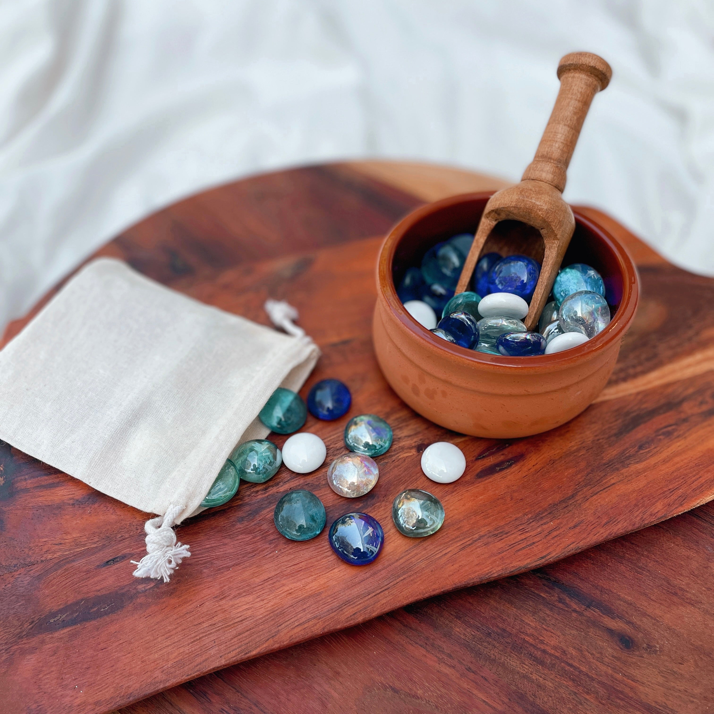Small tumbled stones and crystal chips. Perfect addition to your NZ made play dough, sure to inspire a little sparkle in your child's sensory play. Part of our loose parts collection. perfect for ocean sea play